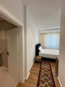 Ένα ή περισσότερα κρεβάτια σε δωμάτιο στο Hotel Celiku