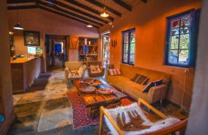 a living room with a couch and a table at Ckoi Atacama Lodge in San Pedro de Atacama