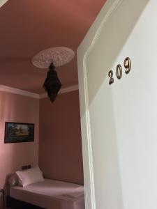 a room with a bed and a ceiling at arganier solitaire in Souira Guedima