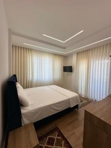 Ένα ή περισσότερα κρεβάτια σε δωμάτιο στο Hotel Celiku