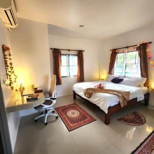 a bedroom with a bed and a desk and a desk at Central Essence-200m beachKoh Phangan west coast in Haad Chao Phao