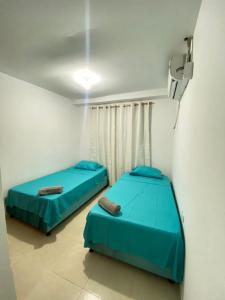 En eller flere senge i et værelse på Paradise in Santa Marta