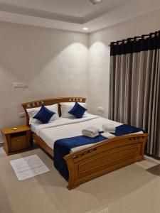 En eller flere senge i et værelse på Invito Beach Resort