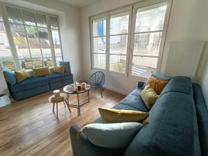 Posezení v ubytování 04- La Potinière- Proche Plage - RDC avec Terrasse- Parking gratuit + 3 fotografie