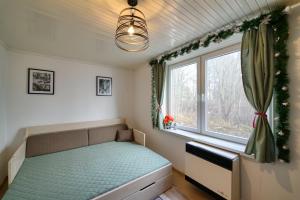 Giường trong phòng chung tại Byt pri lese - pár krokov od Hrebienka