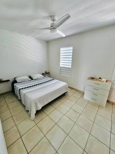 En eller flere senge i et værelse på Palm'Ô Zen