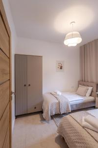 En eller flere senge i et værelse på Widokówka Skrzyczne