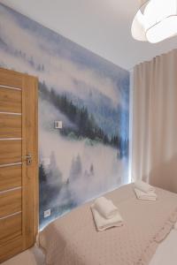 En eller flere senge i et værelse på Widokówka Skrzyczne