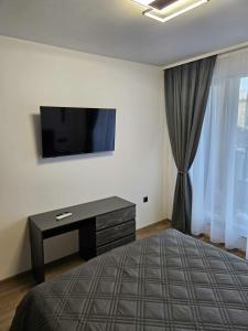 En eller flere senge i et værelse på Boutique apartment 4