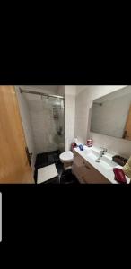 a bathroom with a sink and a toilet at Agadir residence adan beach aourir in Agadir
