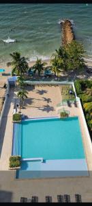 Swimmingpoolen hos eller tæt på Las 4 Estaciones Alojamientos de Ensueño Coveñas