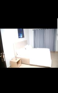 Postel nebo postele na pokoji v ubytování Hilltop apartment Ikeja