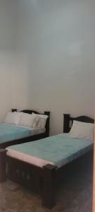 En eller flere senge i et værelse på Casa Los Acacios Piso 2