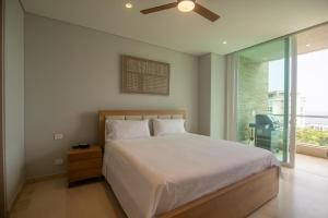 En eller flere senge i et værelse på 2BR for 8 guests with views in Baru + 19 billeder