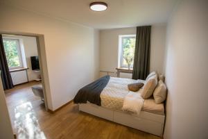 En eller flere senge i et værelse på Stylish Apartment in Lasnamäe