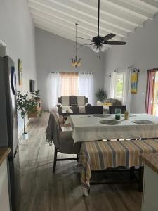 a living room with a large bed and a couch at La Retraite Apt in Rodney Bay Village