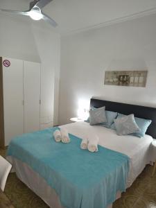 Postel nebo postele na pokoji v ubytování Donatella Guesthouse + 10 fotografií