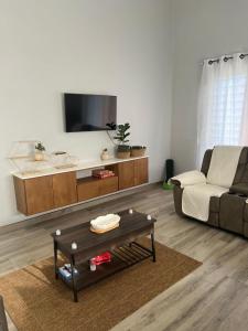 a living room with a couch and a coffee table at La Retraite Apt in Rodney Bay Village +26 photos