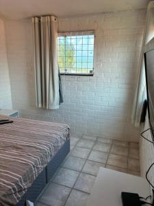 En eller flere senge i et værelse på Casa beira mar Itamaracá