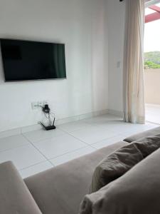 Et tv og/eller underholdning på Búzios apartamento paraíso lll