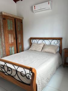 En eller flere senge i et værelse på Búzios apartamento paraíso lll + 9 billeder