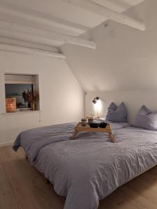 Ένα ή περισσότερα κρεβάτια σε δωμάτιο στο Kjærgaarden B&B - Bed & Breakfast i Havnsø