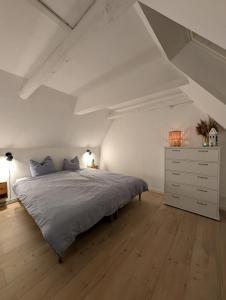 Ένα ή περισσότερα κρεβάτια σε δωμάτιο στο Kjærgaarden B&B - Bed & Breakfast i Havnsø