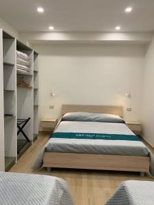 Ένα ή περισσότερα κρεβάτια σε δωμάτιο στο b&b NEAR AIRPORT LAMEZIA