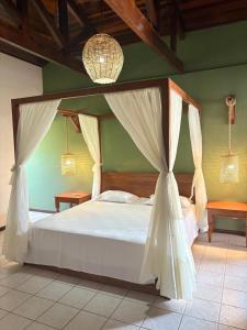 Ένα ή περισσότερα κρεβάτια σε δωμάτιο στο Lagoa Eco Village