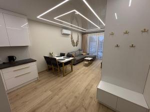 Posezení v ubytování Apartament GOLD Perłowa Przystań