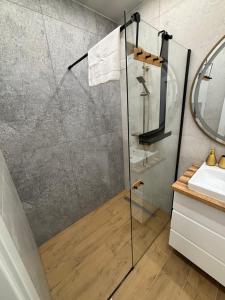 Koupelna v ubytování Apartament GOLD Perłowa Przystań + 6 fotografií