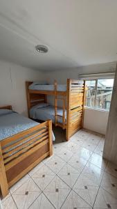 Ένα ή περισσότερα κρεβάτια σε δωμάτιο στο Hostal Del Tuto