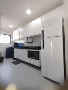 Kuchyň nebo kuchyňský kout v ubytování Apto Aconchegante na Praia do Bessa, até 6 pessoas