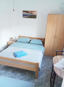 a bedroom with two beds and a cabinet at Villa Abelia in Medulin