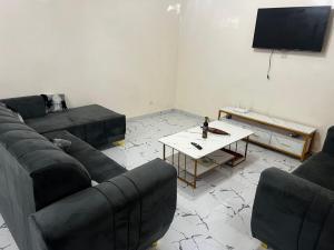 Телевизор и/или развлекательный центр в Chez Khady et Bak