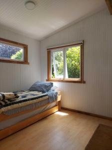 Ένα ή περισσότερα κρεβάτια σε δωμάτιο στο Hostal Pirineos