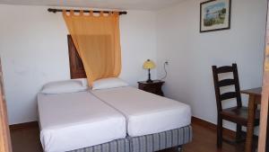 Ένα ή περισσότερα κρεβάτια σε δωμάτιο στο ANDREAS Beach Studios