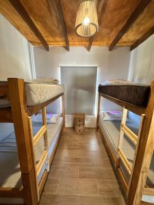 a room with three bunk beds in it at Carpe Diem in Ocean Park