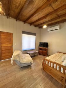 a bedroom with two beds and a television in it at Carpe Diem in Ocean Park