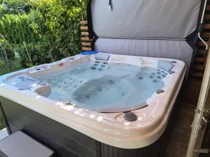 a jacuzzi tub sitting in a backyard at Kuća za odmor Una in Dvor