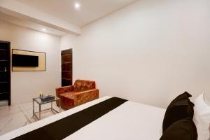 TV a/nebo společenská místnost v ubytování Hotel O by OYO Happy Stay + 29 fotografií