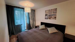 Postel nebo postele na pokoji v ubytování Sea Breeze Apartment