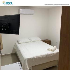 En eller flere senge i et værelse på Risol