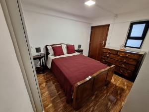 En eller flere senge i et værelse på Casa do Pai