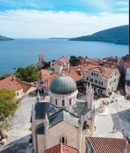 an aerial view of a town with a building with a dome at Apartment Tara in Herceg-Novi