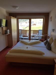 Posteľ alebo postele v izbe v ubytovaní Hotel Garni Alpendiamant