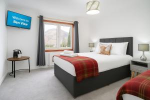 Postel nebo postele na pokoji v ubytování Ben View Guesthouse