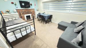 a living room with a bunk bed and a couch at Sabrina's Home in Delta