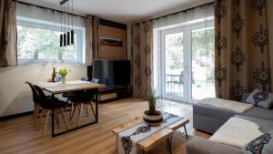 Khu vực ghế ngồi tại Apartamenty Trzy Kopce Ski & Bike & Sauna