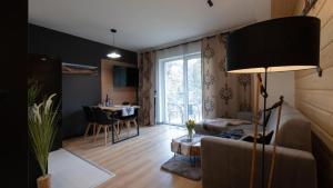 Khu vực ghế ngồi tại Apartamenty Trzy Kopce Ski & Bike & Sauna